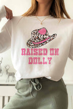 RAISED ON DOLLY GRAPHIC SWEATSHIRT